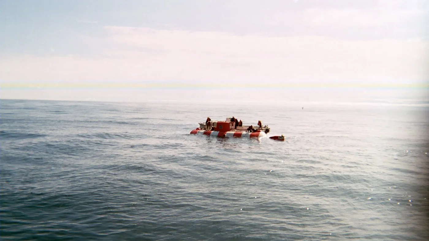The crew leaves the AS-28 Priz after surfacing off Kamchatka, 7 August 2005. Photo: U.S. Navy, public domain
