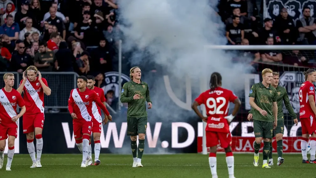 Eredivisie clash FC Utrecht–Go Ahead Eagles abandoned after home fans throw fireworks and cups, raising questions about security